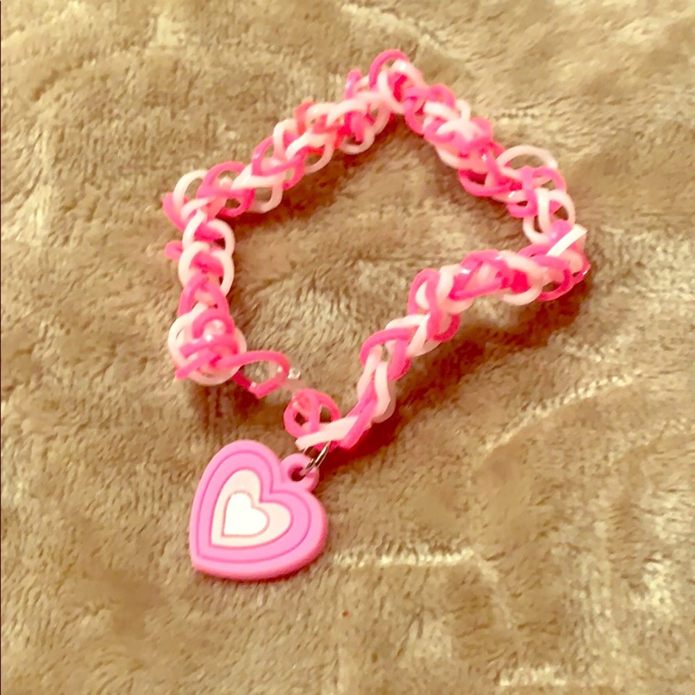 Rubber band bracelet with charm.